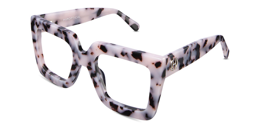Apia eyeglasses in chiffon variant in creamy white & black color with pink shades - tortoiseshell pattern with broad arm and logo on it