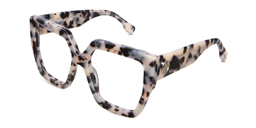 Aruna eyeglasses in sultry variant - tortoiseshell pattern with square shape viewing area and broad arms with logo