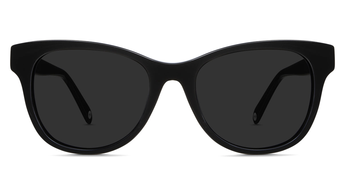 Dumo black tinted Standard Solid sunglasses in aurum variant - it's a transparent frame with regular width nose bridge and a touch of cat eye look on the end piece.