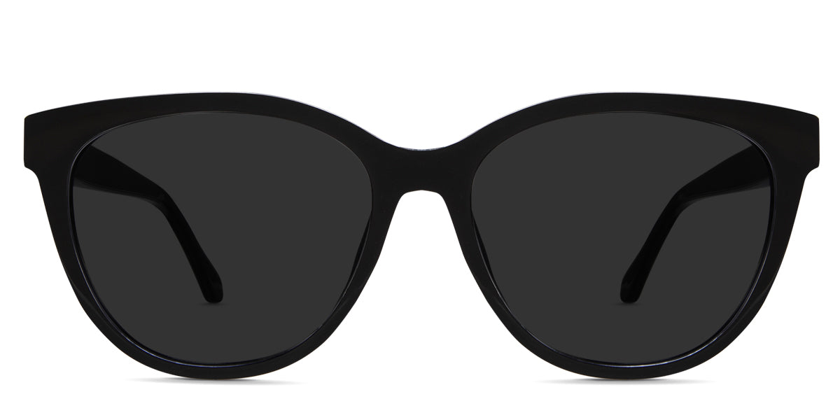 Gava black tinted Standard Solid glasses in onyx variant - a round frame with a touch of cat eye look on the top and end piece of the frame, and its lens provides a wide viewing area.