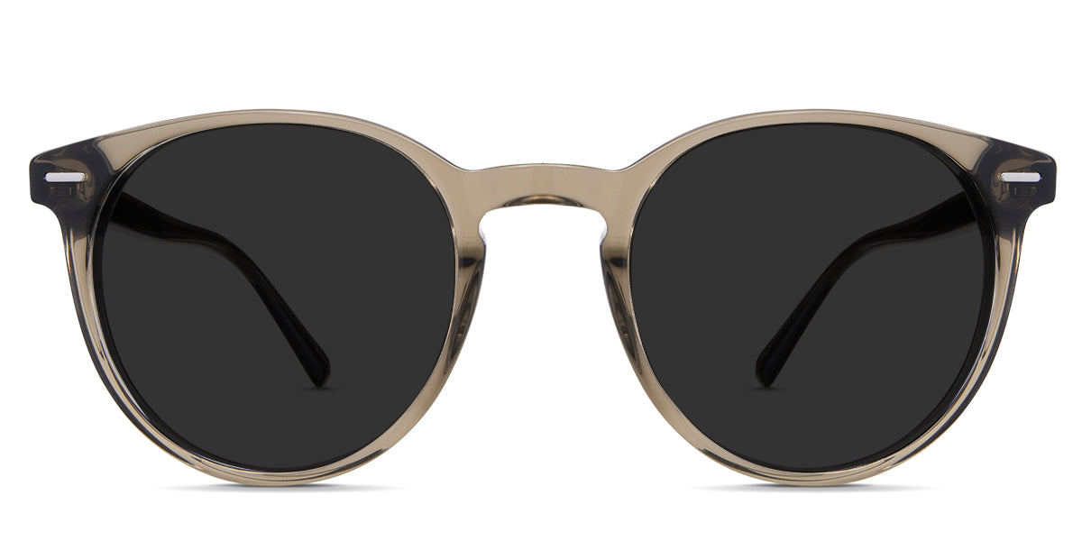 Nasio black tinted Standard Solid sunglasses in stone variant - it's a transparent frame with a round viewing lens and a thin round rim.