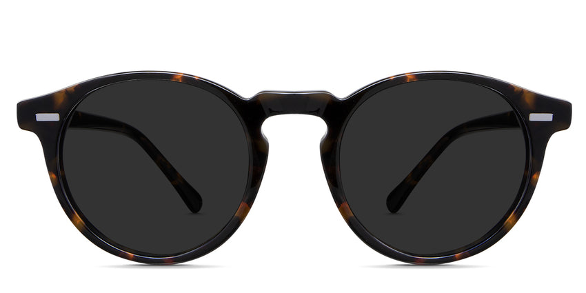 Nito black tinted Standard Solid sunglasses in the hickory variant - it's a tortoise frame with a keyhole shape nose bridge and straight-cut temple arm.