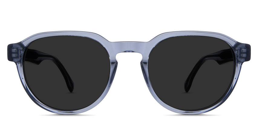 Risto black tinted Standard Solid sunglasses in the mazarine variant - it's a transparent frame with a wide nose bridge and a visible wire core.