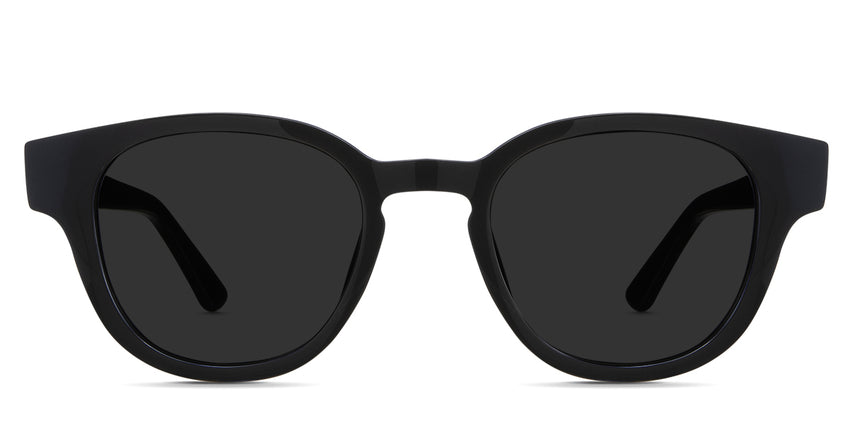 Aris black tinted Solid sunglasses in the midnight variant - it's an oval acetate frame with a keyhole shape nose bridge and a long temple arm with a hockey shape tip.